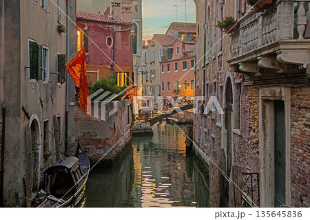 Small Venice bridge over quiet canal Small Venice bridge over quiet canal 135645836