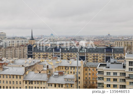 Fogcovered skyline showing old rooftops and narrow alley glimpses 135646053