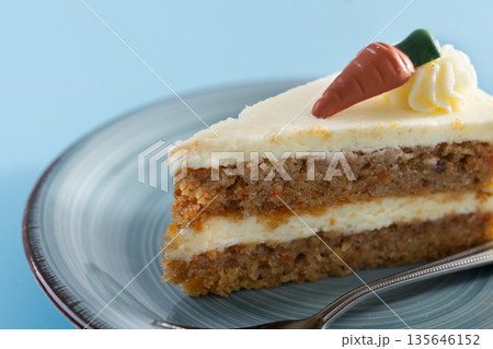 Carrot cake slice with cream cheese frosting Carrot cake slice with cream cheese frosting 135646152