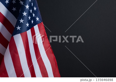 Background for Memorial Day posters, Veterans Day banners, and patriotic holiday designs. American flag on black background with copy space. Background for Memorial Day posters, Veterans Day banners, and patriotic holiday designs. American flag on black background with copy space. 135646898