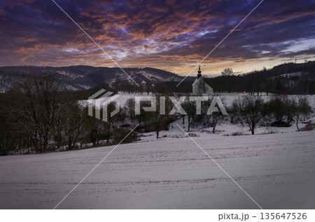 Winter landscape with a beautiful chapel near castle Veveri. Czech Republic city of Brno. The Chapel of the Mother of God. 135647526