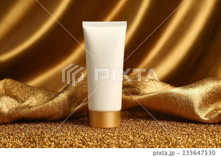 cream cosmetic tube bottle, pieces of gold paper, wave golden fabric. shampoo, shower gel, moisturizer. mockup, cosmetic skincare product blank plastic package cream cosmetic tube bottle, pieces of gold paper, wave golden fabric. shampoo, shower gel, moisturizer. mockup, cosmetic skincare product blank plastic package 135647530