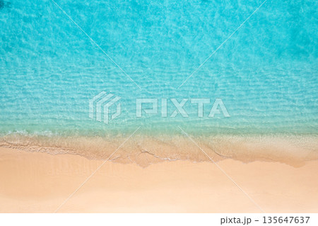 Aerial top view of tropical beach with calm waves and sandy shore 135647637