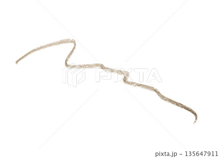 A brown stroke from a cosmetic eyebrow pencil. Isolated on a white background. A brown stroke from a cosmetic eyebrow pencil. Isolated on a white background. 135647911