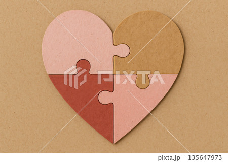 Heart puzzle assembled from recycled paper piece in romantic pink muted red and kraft paper hue representing sustainable love symbol connection unity Heart puzzle assembled from recycled paper piece in romantic pink muted red and kraft paper hue representing sustainable love symbol connection unity 135647973