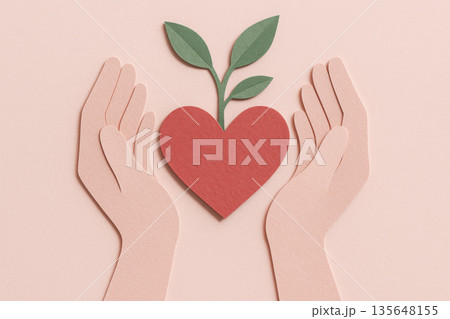 Paper cut hand holding heart with sprouting leaf gentle shadow tactile texture pastel pink dusty red natural green palette environment care love growth concept 135648155