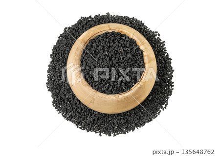 Nigella sativa or Black cumin in wooden bowl isolated on white background. Top view. Flat lay Nigella sativa or Black cumin in wooden bowl isolated on white background. Top view. Flat lay 135648762