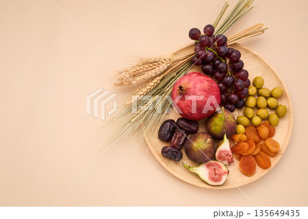 Displaying seven species traditional tu bishvat ingredients on tray 135649435