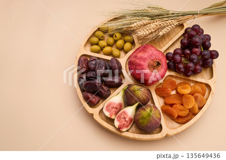 Tu bishvat seder plate with seven species fruits Tu bishvat seder plate with seven species fruits 135649436