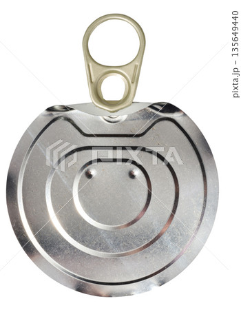 Metal tin can lid with ring opener, isolated background. Metal tin can lid with ring opener, isolated background. 135649440
