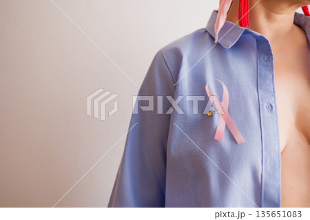 Pink ribbon symbolizing breast cancer awareness month concept Pink ribbon symbolizing breast cancer awareness month concept 135651083