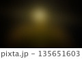 Dark abstract background with golden light glow in the center 135651603