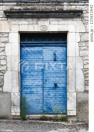 Ancient blue door in the medieval village of Martel in France Ancient blue door in the medieval village of Martel in France 135651642