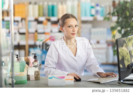 Young Pharmacist Standing Near Computer Young Pharmacist Standing Near Computer 135651882