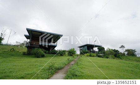 Modern eco lodges integrated into costa rica rainforest landscape Modern eco lodges integrated into costa rica rainforest landscape 135652151