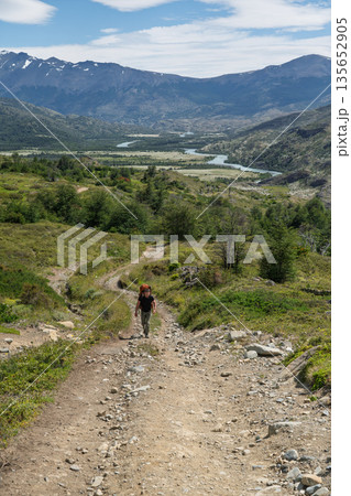 Hiker walking rugged trail, Torres del Paine, Chile Hiker walking rugged trail, Torres del Paine, Chile 135652905