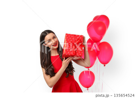 Woman smiles, presenting a gift with polka dots, isolated, PNG Woman smiles, presenting a gift with polka dots, isolated, PNG 135654524