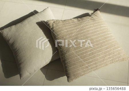 beige cushions lying on the floor beige cushions lying on the floor 135656488