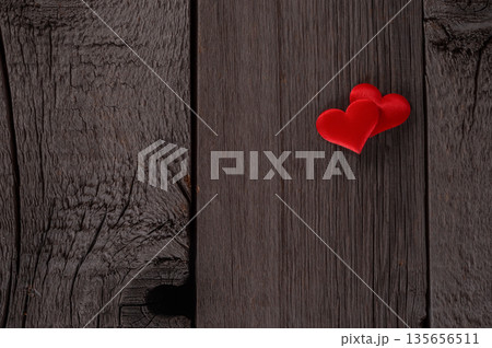 Two Red Hearts on Rustic Wooden Texture with Romantic Symbolism. Valentines Day and Love Wallpaper Background. Two Red Hearts on Rustic Wooden Texture with Romantic Symbolism. Valentines Day and Love Wallpaper Background. 135656511