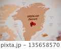 Greenland pinned on world map with red push pin. Travel destination Greenland pinned on world map with red push pin. Travel destination 135658570