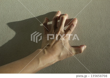 A woman's hand with bulging tendons A woman's hand with bulging tendons 135658708