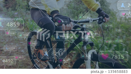 Riding cyclist wearing yellow cycling jacket on mountain bike along forest trail, with social icons Riding cyclist wearing yellow cycling jacket on mountain bike along forest trail, with social icons 135658883