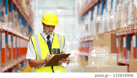 Inspector wearing hard hat and vest inspecting boxes in warehouse aisle, with clipboard icons 135658906