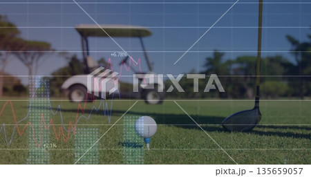 Featuring white golf ball resting on blue tee at golf course fairway, with financial data overlays 135659057