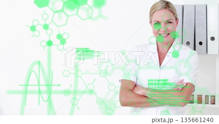 Standing woman wearing lab coat in lab, showing green overlays, binders, vials, copy space Standing woman wearing lab coat in lab, showing green overlays, binders, vials, copy space 135661240