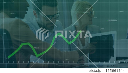 Analyzing data, three professionals examining laptop in office, with green chart overlay 135661344