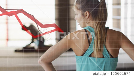 Fitness instructor facing trainee stretching in studio, with yoga mat, grid, downward graph overlay Fitness instructor facing trainee stretching in studio, with yoga mat, grid, downward graph overlay 135661674