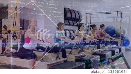 Kneeling five women in sportswear grasping reformer bars in pilates studio, with financial overlay Kneeling five women in sportswear grasping reformer bars in pilates studio, with financial overlay 135661684