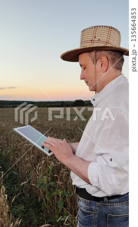 farmer s connection with nature, agritech in action, agricultural revolution with technology, natural farming environment, rural farm lifestyle, high-tech farming solutions, ecological crop management farmer s connection with nature, agritech in action, agricultural revolution with technology, natural farming environment, rural farm lifestyle, high-tech farming solutions, ecological crop management 135664853
