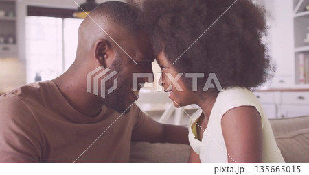 Pressing foreheads father and daughter bonding in home living room, with sofa throw pillows Pressing foreheads father and daughter bonding in home living room, with sofa throw pillows 135665015