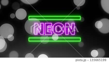 Glowing purple NEON sign shining against dark backdrop, with green bars and gray bokeh circles 135665199