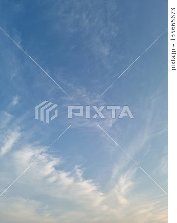 It's a sunset sky with fluffy clouds. 135665673