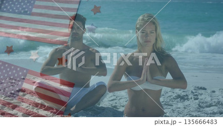 Couple kneeling in prayer in white swimwear on beach, with US flag overlays and star graphics 135666483