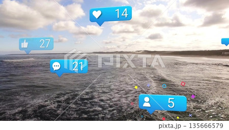 Displaying rolling ocean waves at beach, featuring bright blue social media engagement icons Displaying rolling ocean waves at beach, featuring bright blue social media engagement icons 135666579