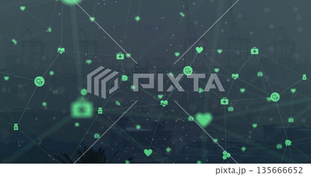 Displaying network of green medical icons overlaying harbor skyline at dusk, digital health theme Displaying network of green medical icons overlaying harbor skyline at dusk, digital health theme 135666652
