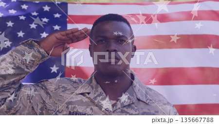Saluting soldier wearing camouflage uniform at ceremony, with American flag and star overlay Saluting soldier wearing camouflage uniform at ceremony, with American flag and star overlay 135667788