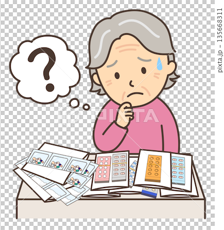 An elderly woman looks troubled by the large number of medicines she has 135668311