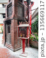 Traditional brick incense burner and altar with offerings at Sin Sze Si Ya Temple courtyard, Kuala Lumpur, Malaysia 135669117