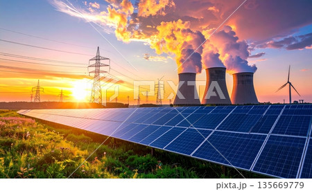 Modern solar power station panels on the roof capture energy under a sunset sky near high voltage industrial transmission lines and steel pylons for a sustainable electric supply Modern solar power station panels on the roof capture energy under a sunset sky near high voltage industrial transmission lines and steel pylons for a sustainable electric supply 135669779