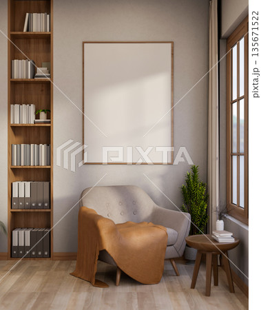 Sofa chair with blanket under white frame on wall and table aside wooden bookshelf on parquet floor. 135671522