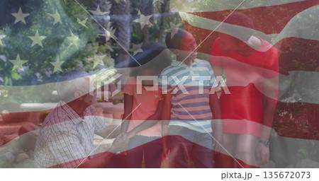 Holding girl's hand, grandfather watching boy and mother in red dress leaning on bench in park Holding girl's hand, grandfather watching boy and mother in red dress leaning on bench in park 135672073
