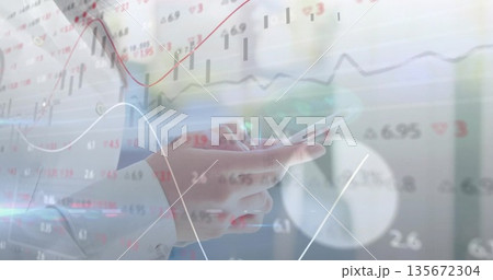 Tapping smartphone, Asian woman's hands wearing blouse in office, with financial chart overlays Tapping smartphone, Asian woman's hands wearing blouse in office, with financial chart overlays 135672304