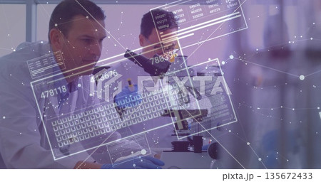 Scientists in lab coats examining samples using microscope at lab bench, with digital data overlays Scientists in lab coats examining samples using microscope at lab bench, with digital data overlays 135672433
