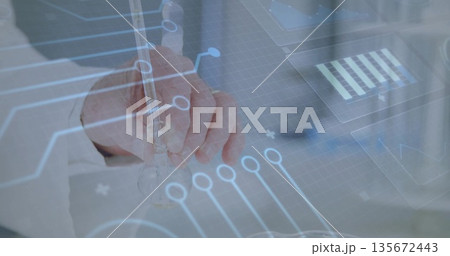 Analyzing male scientist in lab coat handling glass pipette on lab bench, circuit data overlay 135672443