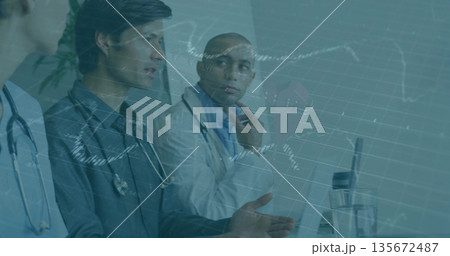 Male doctor speaking in hospital conference room, with laptop stethoscope chart overlay, copy space Male doctor speaking in hospital conference room, with laptop stethoscope chart overlay, copy space 135672487