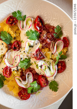 Salad with stracciatella cheese tomatoes herbs Salad with stracciatella cheese tomatoes herbs 135672846